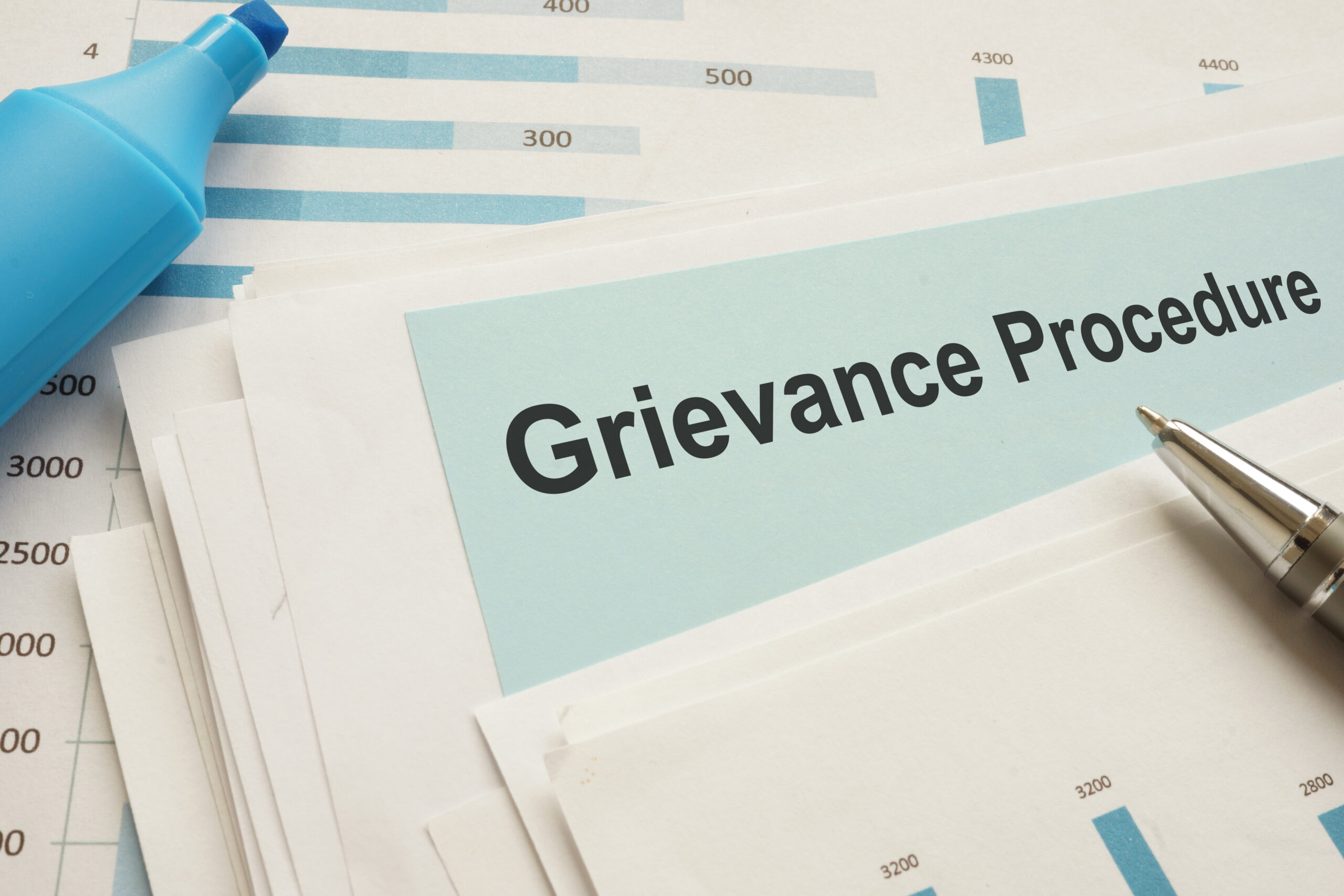 Grievance procedure is shown on the photo using the text