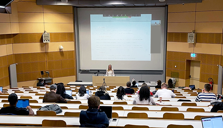 Professor Dorothée Baumann-Pauly speaking to students in a lecture hall