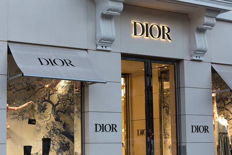 Exterior of Dior building with illuminated logos
